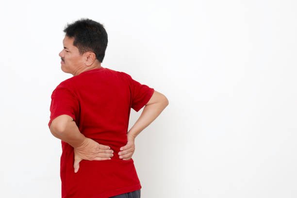 Back view of a guy suffering from a backache